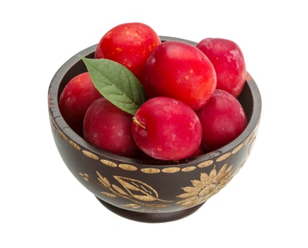 Damson plum in a bowl on white background photo