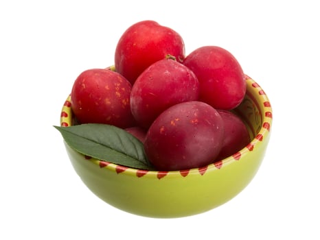 Damson plum in a bowl on white background photo