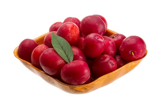 Damson plum in a bowl on white background photo