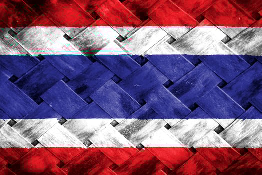 Thailand flag screen on wicker wood background photo