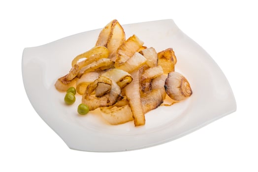 Fried onion on the plate and white background photo