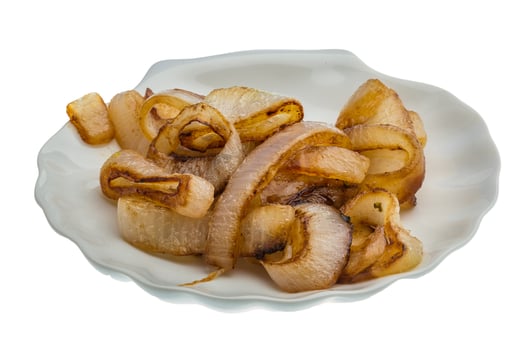 Fried onion on the plate and white background photo