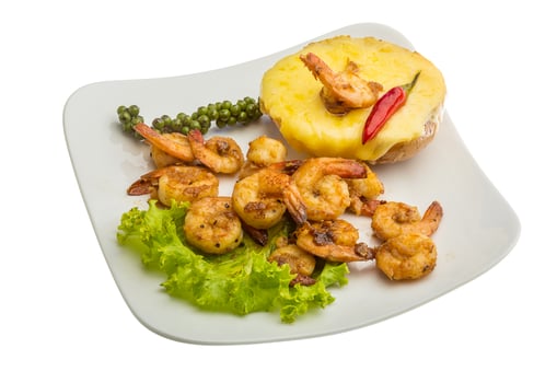 Garlic shrimps with potato on the plate and white background photo