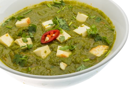 Sag Paneer in a bowl on white background photo