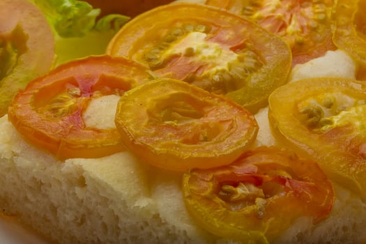Pizza with sliced tomato photo
