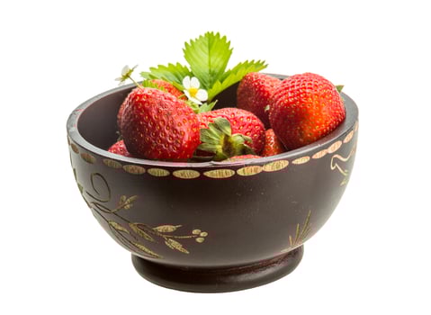 Ripe strawberry in a bowl on white background photo