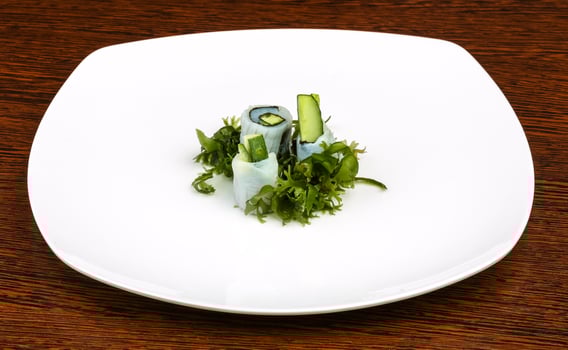 Squid sashimi on the plate and wooden background photo
