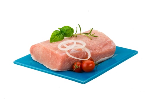 Raw pork with onion, basil and rosemary photo