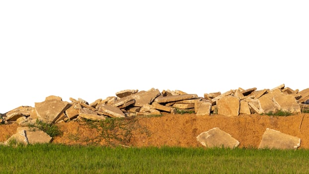 Concrete debris piled on a mound above the meadow. photo