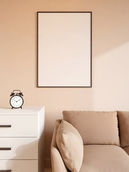 Modern and minimalist vertical black poster or photo frame mockup on the wall in the living room. 3d rendering.