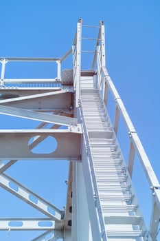 Metal staircase leading to the top of the bridge. photo