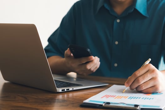 male executive analyzing and planning business sales performance from financial data, analyzing finance sales data and economic growth graph chart. photo