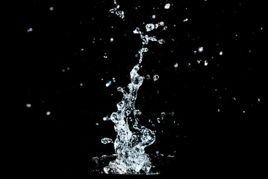 Abstract background of Water splashing on a black background. idea for freshness photo
