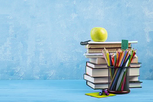Set of colorful school supplies, books and notebooks. Stationery accessories. photo