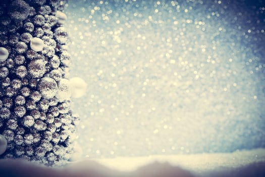 Winter Christmas decoration. Snow, glitter and Christmas tree ornament. photo
