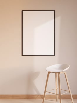 Modern and minimalist vertical black poster or photo frame mockup on the wall in the living room. 3d rendering.