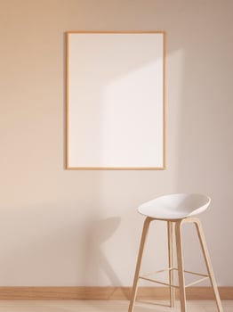 Modern and minimalist vertical wooden poster or photo frame mockup on the wall in the living room. 3d rendering.