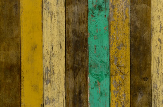 Yellow, green, and brown wooden wall texture background. Old wood floor with cracked color paint. Vintage wood abstract background with peeling paint. Green and yellow painted on brown wood texture. photo