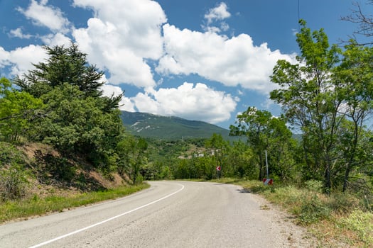 An old European road in the mountains along the rocks. Coast of the Black Sea. photo