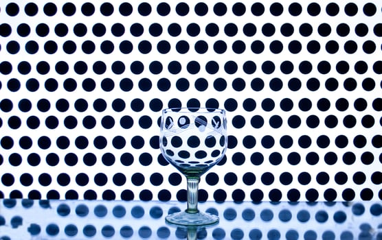 Glass wine glass on a background of circles photo