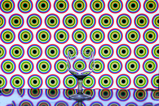 glass wine glass on colored background circles photo