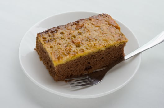 Caramel Peanut-Topped Brownie Cake. photo