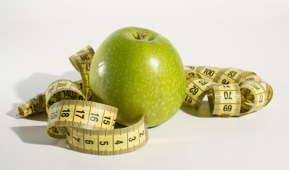 Apple and measuring tape, Diet. photo