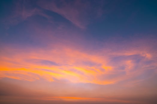 Dramatic orange sky and clouds abstract background. Art picture of orange clouds texture. Beautiful sunset sky. Sunset abstract background. Golden sky in the evening. Calm and relax life. photo