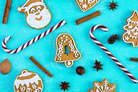 Christmas homemade gingerbread cookies on blue background. Top view photo