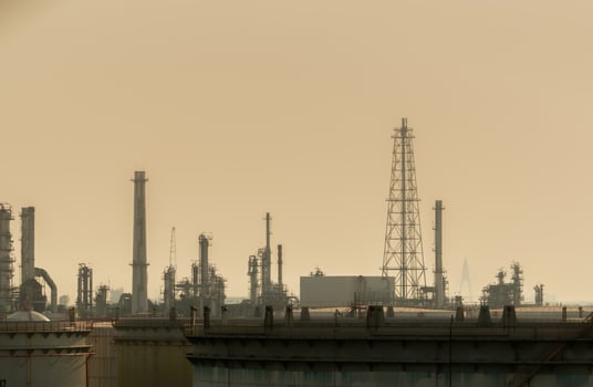 Air pollution at oil petroleum refinery plant. Bad air quality filled with dust. Global warming from air pollution problem. Environmental problem from gas carbon monoxide and dust. PM 2.5 problem. photo