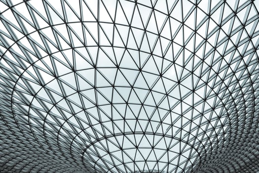 Glass and steel building with triangle pattern structure. Futuristic architecture. Neo-futurism architectural style. White triangle geometric dome texture. Creative art design of modern building. photo