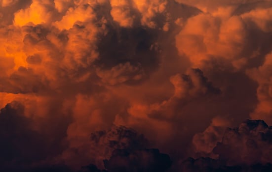 Red, orange fluffy clouds on sunset sky background. Art picture of orange clouds texture. Beautiful pattern of clouds. Dark and horror scene of sky. Beauty in nature. Powerful and spiritual scene. photo