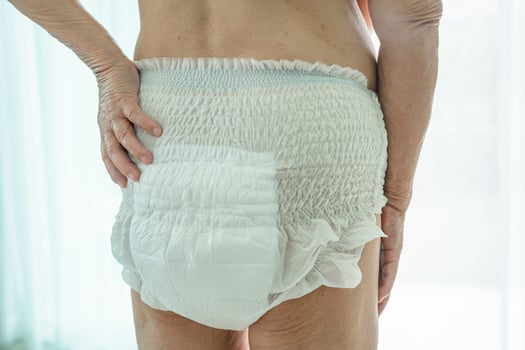 Asian senior or elderly old lady woman patient wearing incontinence diaper in nursing hospital ward, healthy strong medical concept. photo
