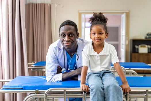 African american doctor and kid patient portrait on the hospital clinic appointment for diagnosis and medical checkup photo
