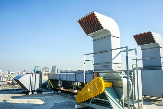 The industrial machine at the rooftop of the huge building. photo