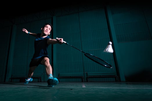 professional badminton player use racquet hit shuttle cock or shuttlecock on court during warm up play before tournament competition in single man type in indoor court photo