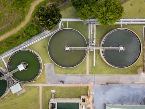 Aerial view of circular water treatment tank for cleaning up and recycling the contaminated wastewater from industrial estate photo