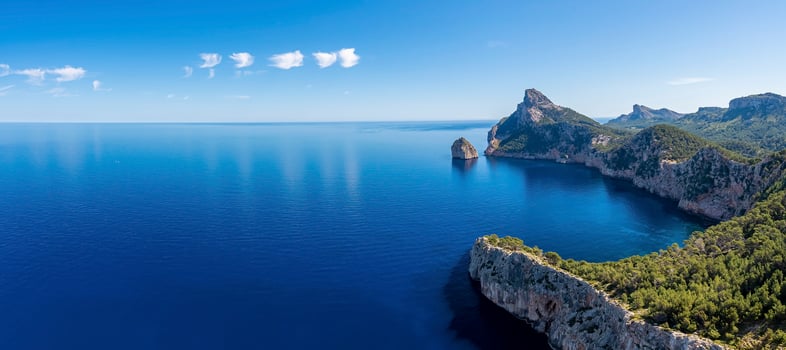 High angle panoramic view of Mediterranean seascape and rocky cliffs against sky photo