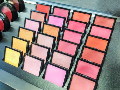 Cosmetic products the portions of colorful eyeshadow for makeup experiment as background. photo