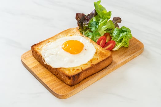 bread toasted with cheese and fried egg photo