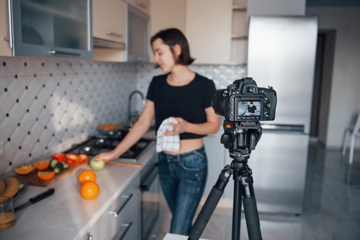 Professional expensive studio equipment. Girl in the modern kitchen at home at her weekend time in the morning photo