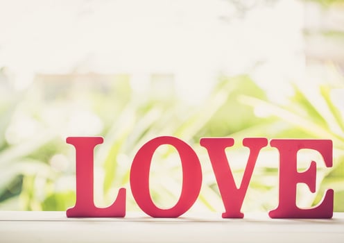 Word LOVE wooden text vintage on wood table vintage retro tone, sign and romantic of Valentine, holiday concept. photo