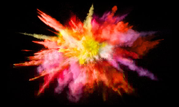 Colorful powder explosion, isolated on black background photo