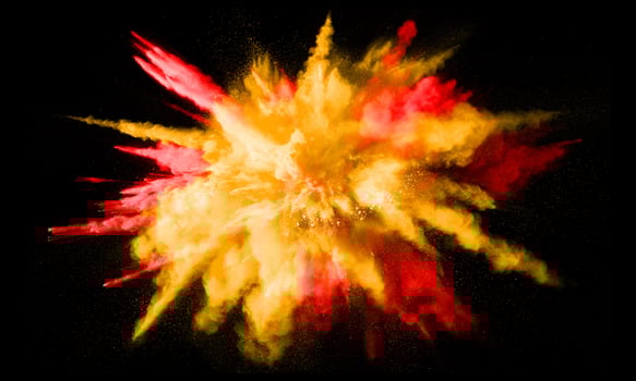 Colorful powder explosion, isolated on black background photo