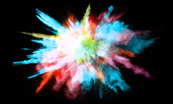 Colorful powder explosion, isolated on black background photo