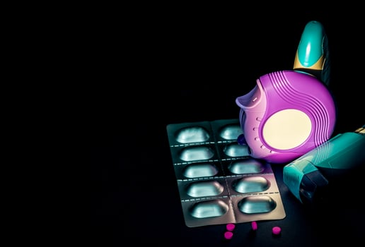 Set of asthma inhaler, accuhaler and anti-allergy pills for treatment asthma. Asthma controller, reliever equipment on dark background with space. Bronchodilator and steroids drug for severe asthma. photo