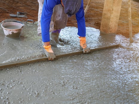 Plasterers are using equipment to smooth the plaster. photo