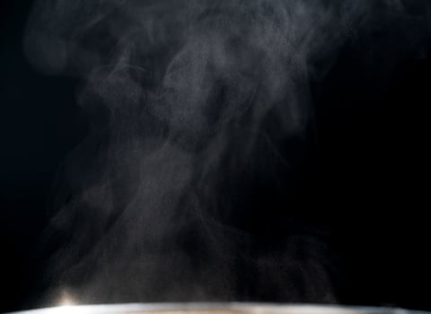 White and gray steaming on black abstract background with copy space for text. photo