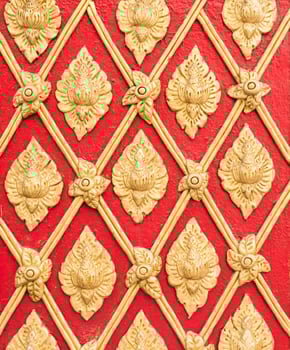 Golden stucco pattern in the traditional Thail style. photo