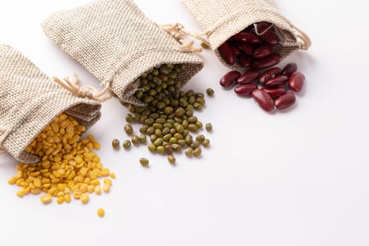 Red beans, soybeans, green beans in burlap bags photo